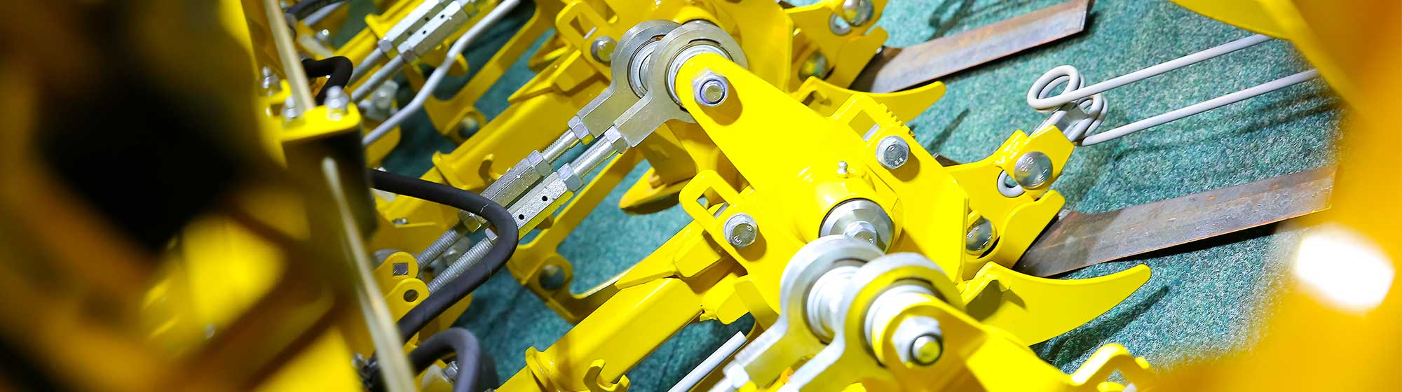 Cogs of a yellow agricultural machine